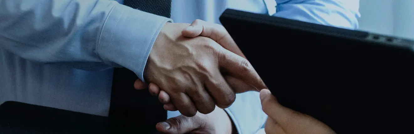 Corporate men shaking hands